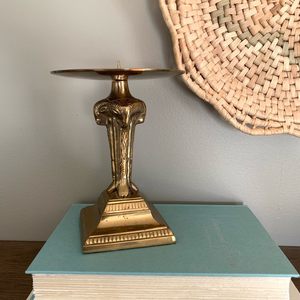 Brass pillar candle holder. 6” tall x 5” wide Aries Ram figures